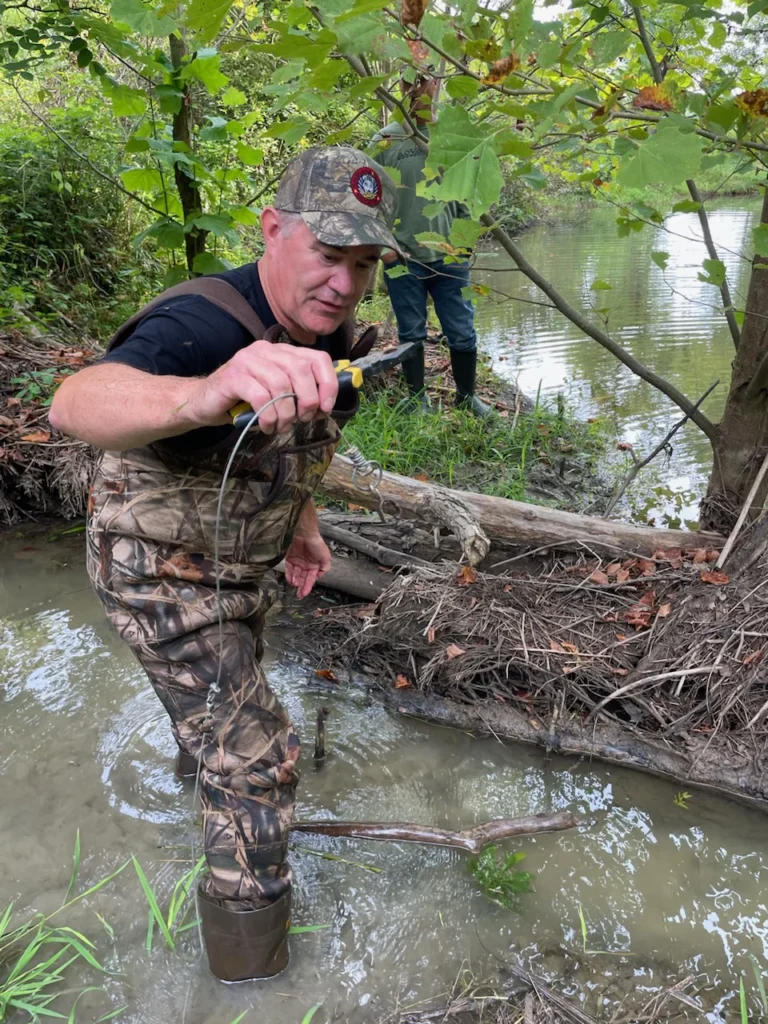 Dan holding up a beaver snare