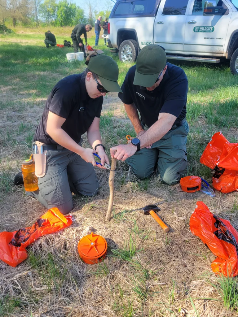 Two PA Game Warden cadets practicing trapping
