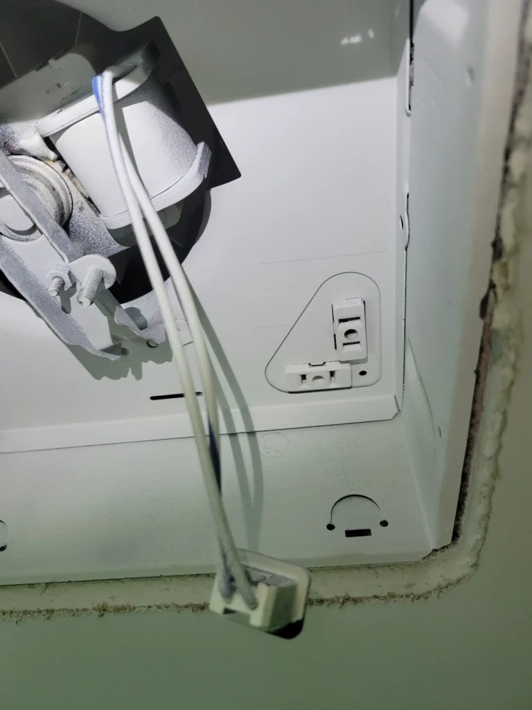 A ceiling vent being removed