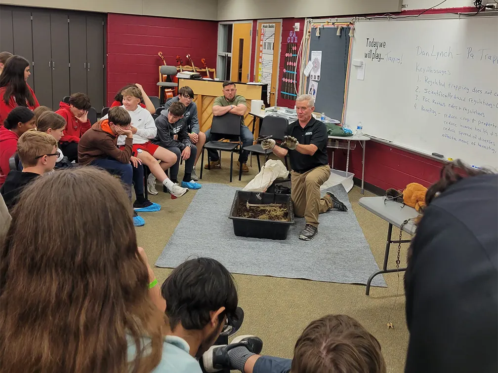 Dan teaching trapping to students at Wilson Middle School